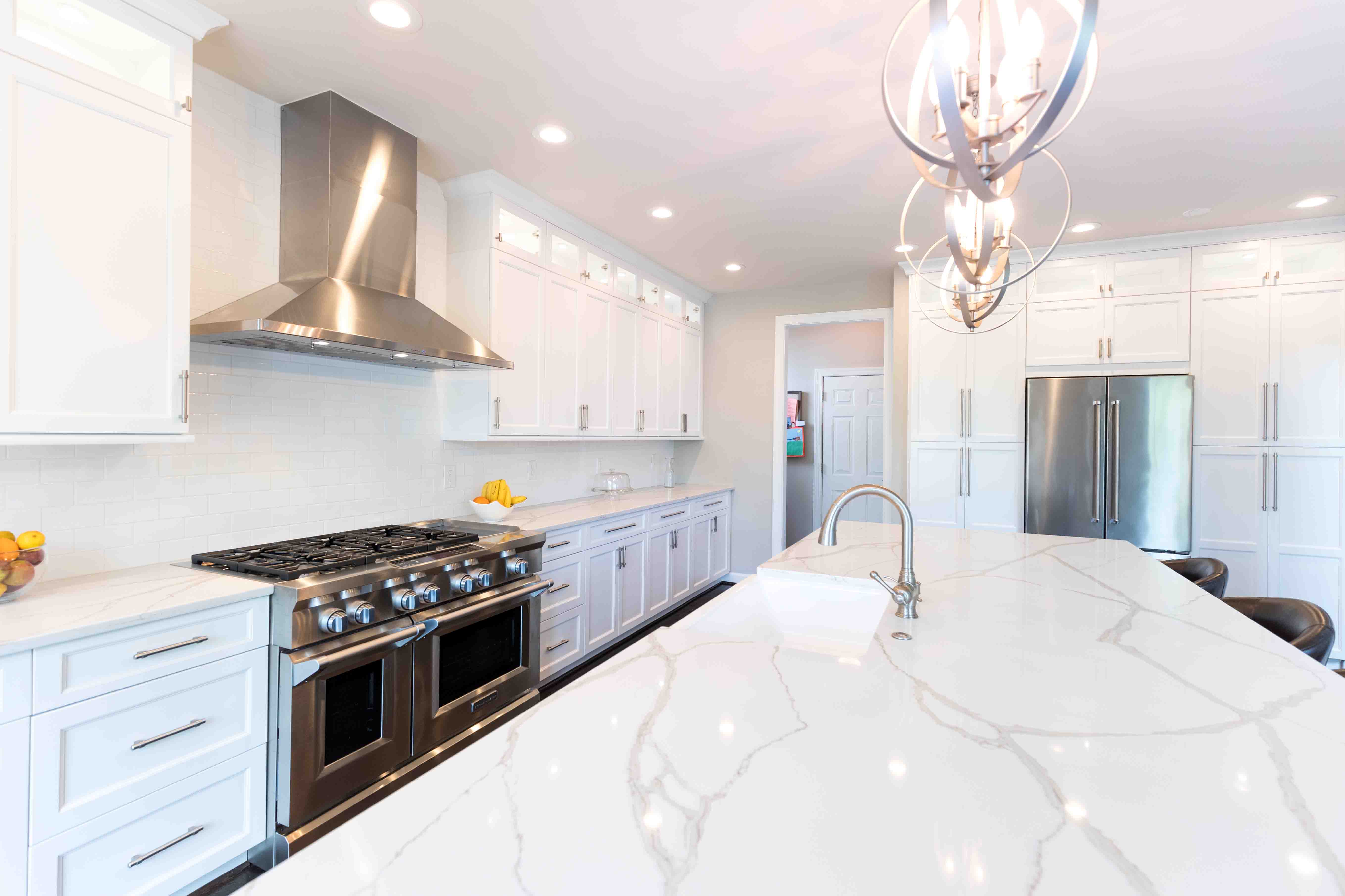 Minimalist White Kitchen Cabinets With White Countertops for Large Space